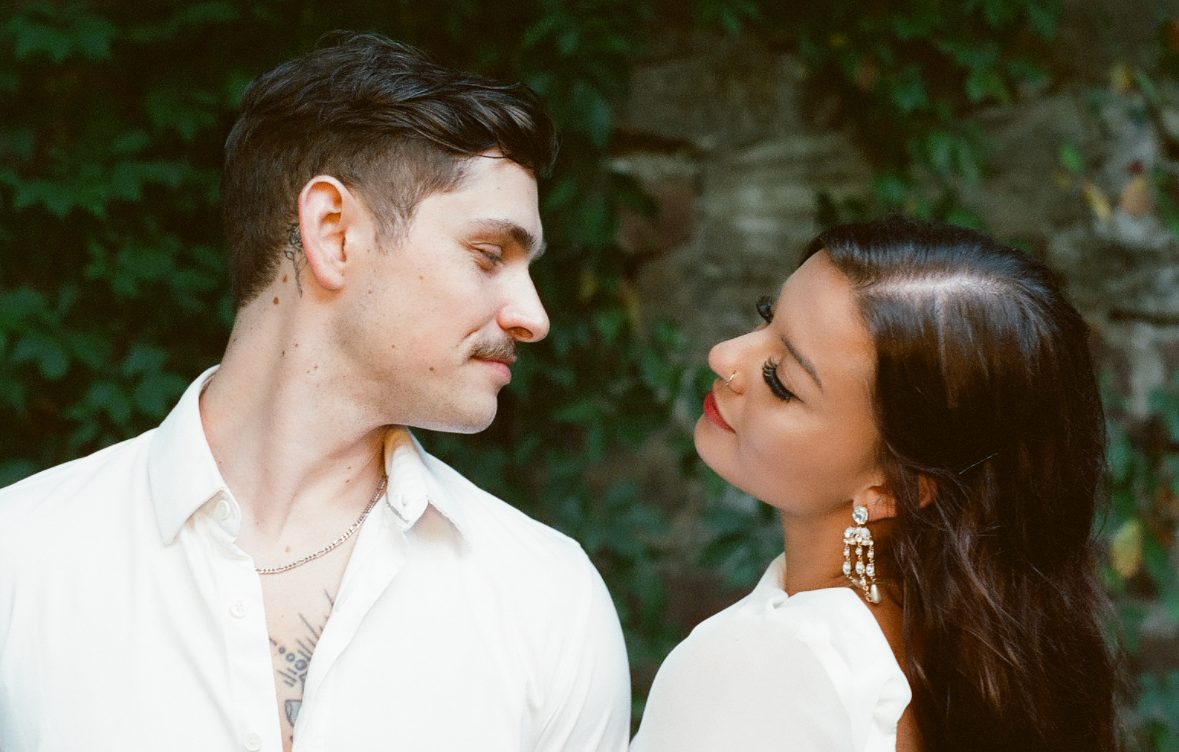 Alyssa and Giovanni looking at each other at their engagement party
