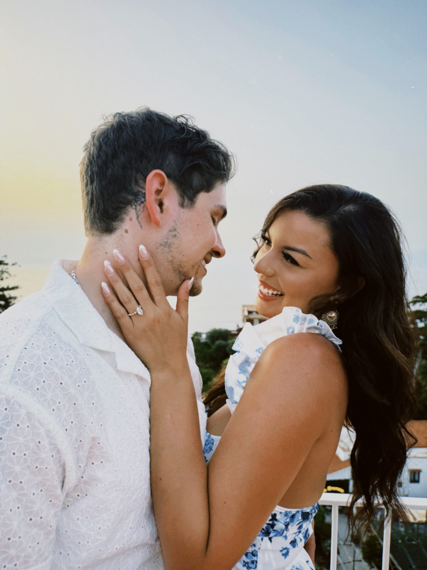 Giovanni proposing to Alyssa on a terrace in Sorrento at sunset
